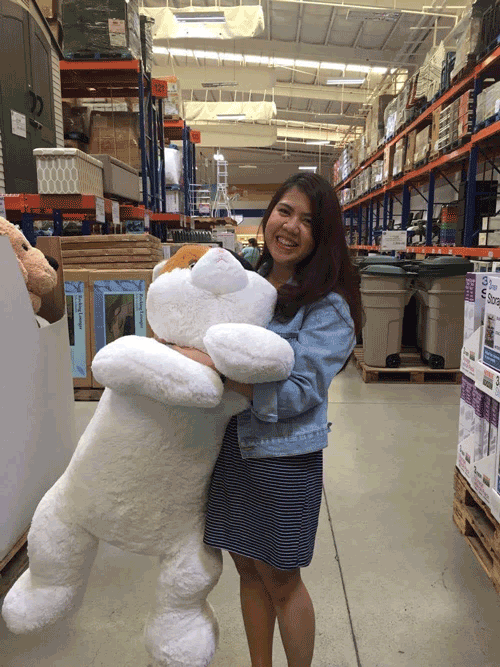Pauline with a huge stuff toy smiling brightly